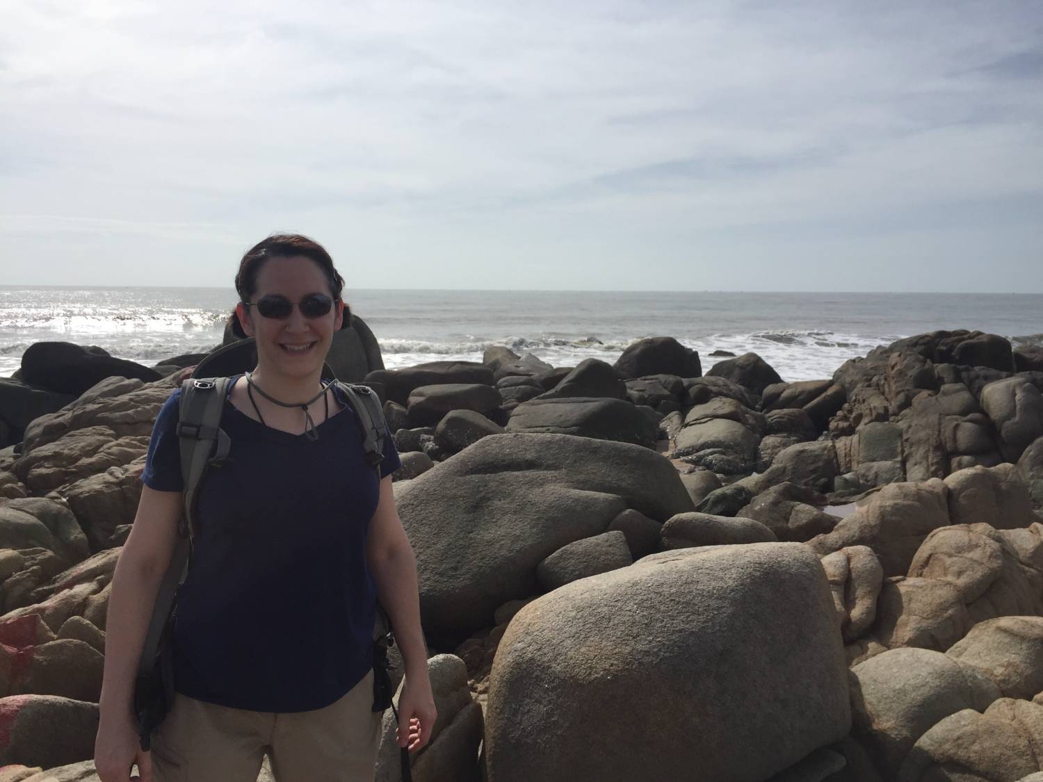 Lynne Elkins next to a mound of rocks