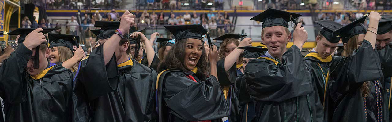 Students at Commencement moving their tassels