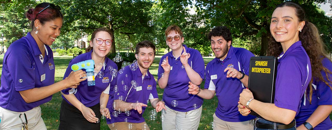 orientation leaders under tent