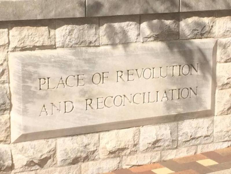Photo of cornerstone with quote Place of Revolution and Reconcilitation. From Kelly Ingram Park in Birmingham AL where Bull Connor released firehoses and dogs on the protestors. Many were children. It is across the street from the 16th St Baptist Church where the four little girls were killed and a fifth badly injured. Photo Credit: D. Johnson October 2017.