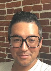 korean-american man loooking at camera