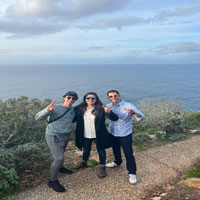Group posing with ramsup hand sign