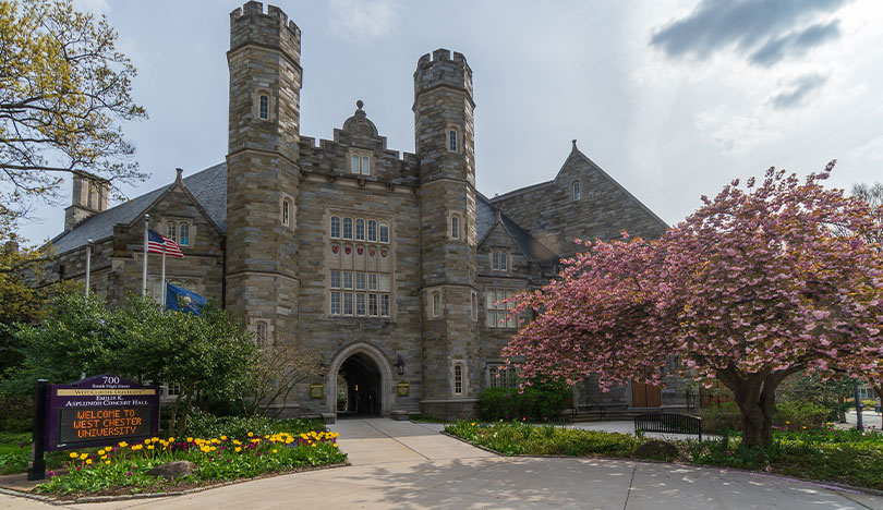 Exterior image of Asplundh Hall with the WCU sign in the foreground.