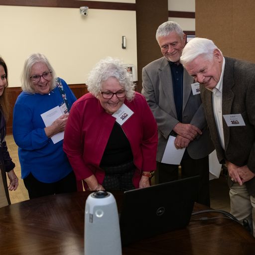 group of people looking at computer screen