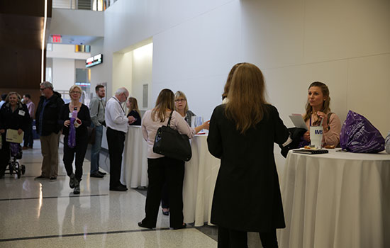Group of faculty and staff networking at the RECAP conference