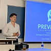 Student teaching in front of projector