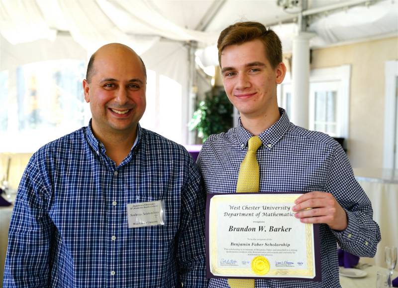 Dr. Andreas Aristotelous presenting Brandon W. Barker with the Benjamin E. Faber Scholarship
