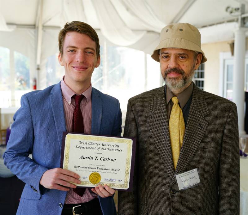 Dr. Viorel Nitica presenting the Katherine Smith Math Scholarship to Austin T. Carlson