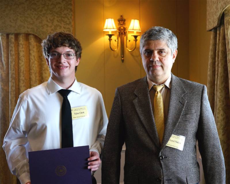 Tyler Clark receiving his award