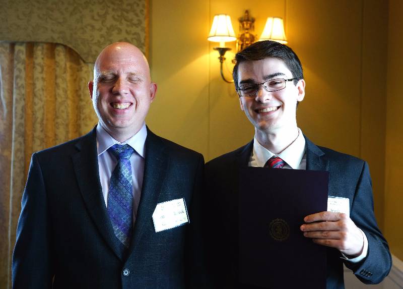 Paul Dewalt receiving his award