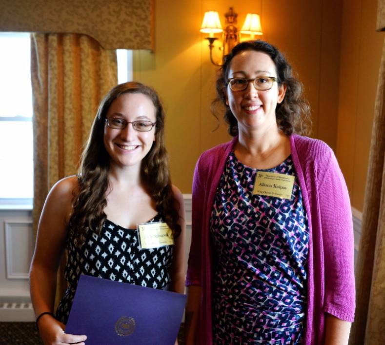 Kelly Schmook receiving her award