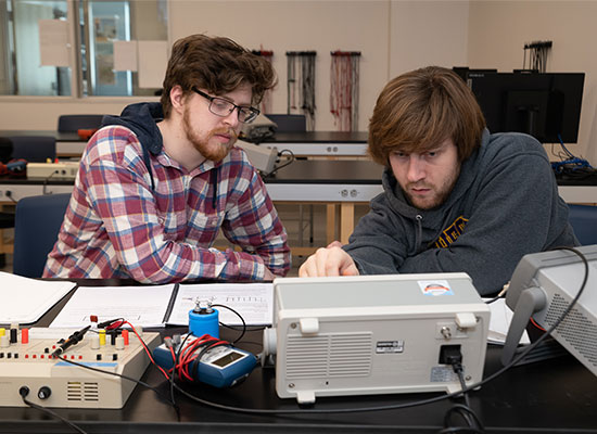 Physics student working in a group